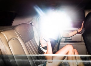 Purse that flashes a bright light that interferes with anyone trying to take a picture of the person with the clutch