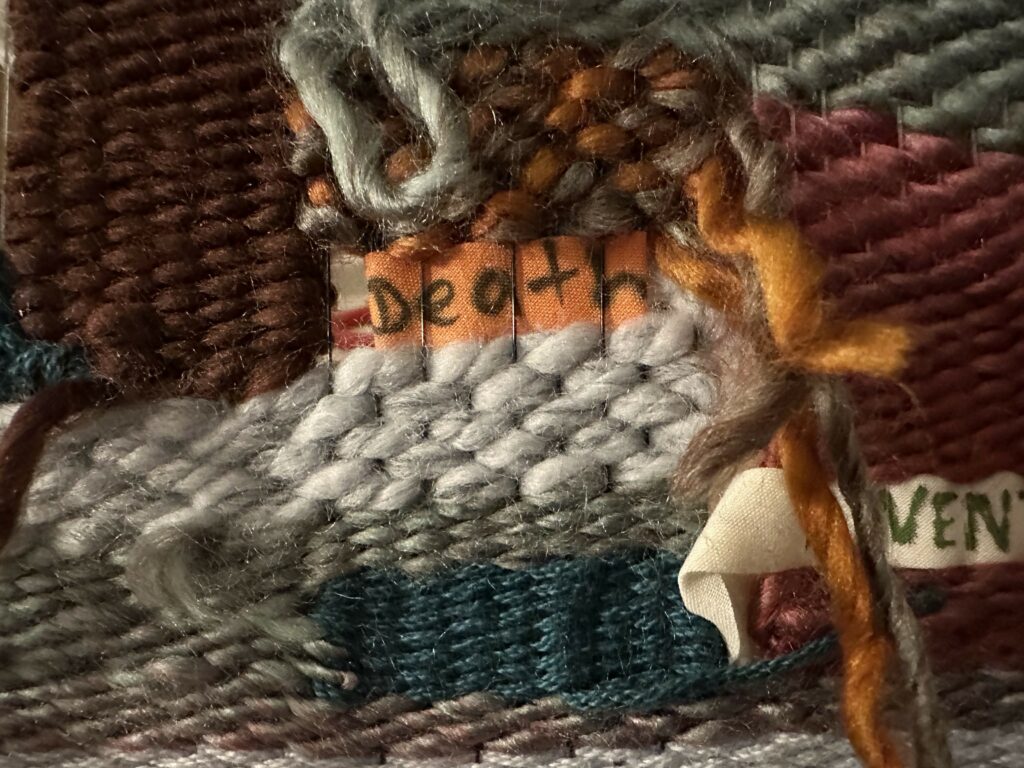 Detail of some weaving techniques as well as an added keyword that reads "Death"